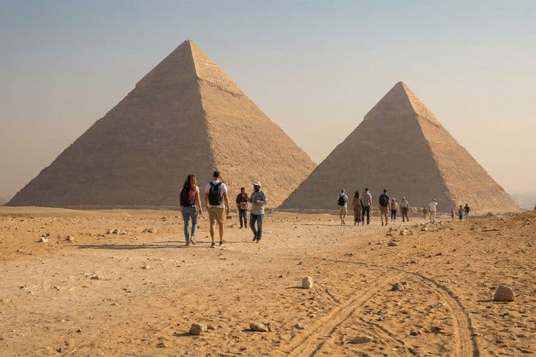 Visitors walking towards the Pyramids of Giza luxor aswan cruise, fayoum oasis tour