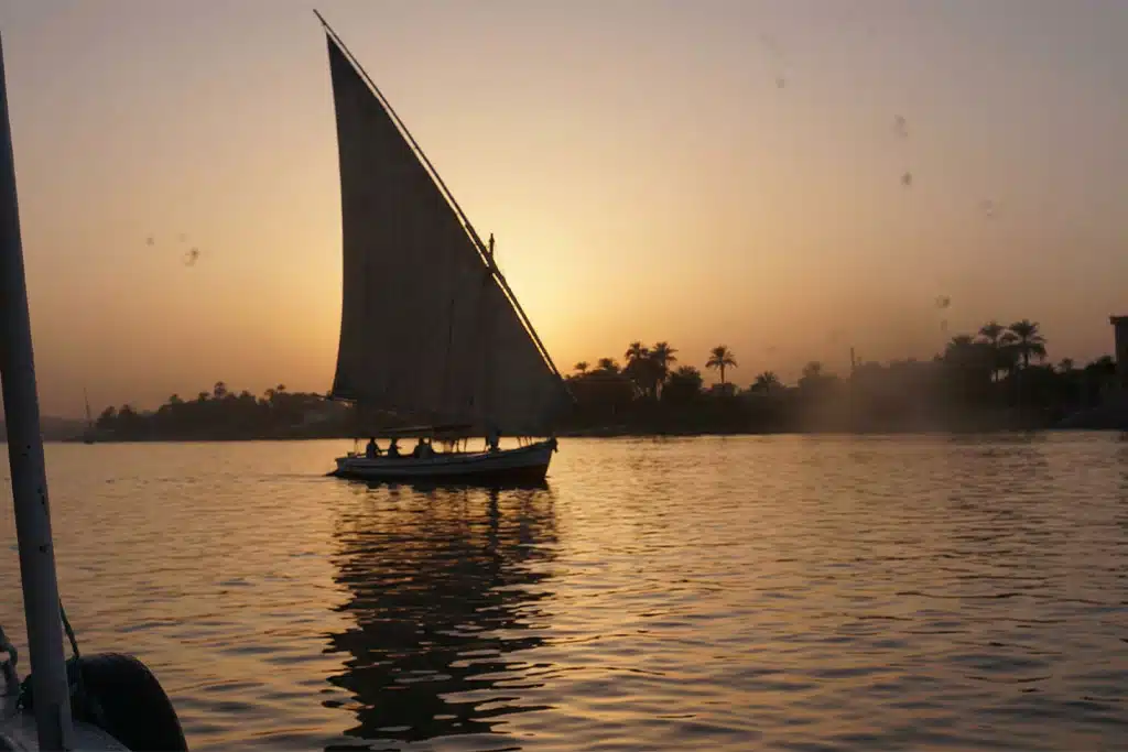 Sailboat at sunset on the Nile cairo nile cruise, Giza Pyramids tour