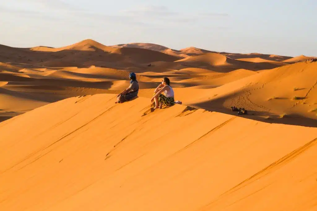 Two people enjoying the view in the Sharm El-Sheikh desert while atv quad polaris, riding quads near me