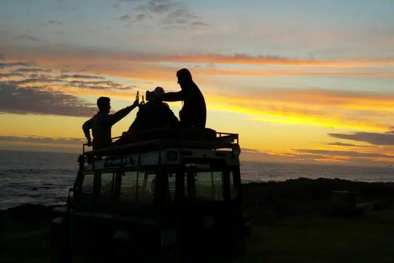 Friends toasting at sunset while atv quad polaris, riding quads near me