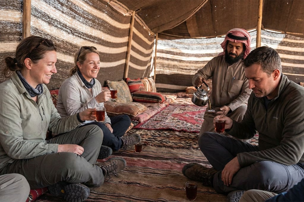Group enjoying tea in a Bedouin tent hurghada desert safari, quad biking hurghada