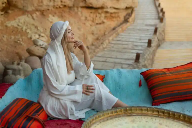 Woman relaxing in a Bedouin village after hurghada desert safari, camel ride hurghada