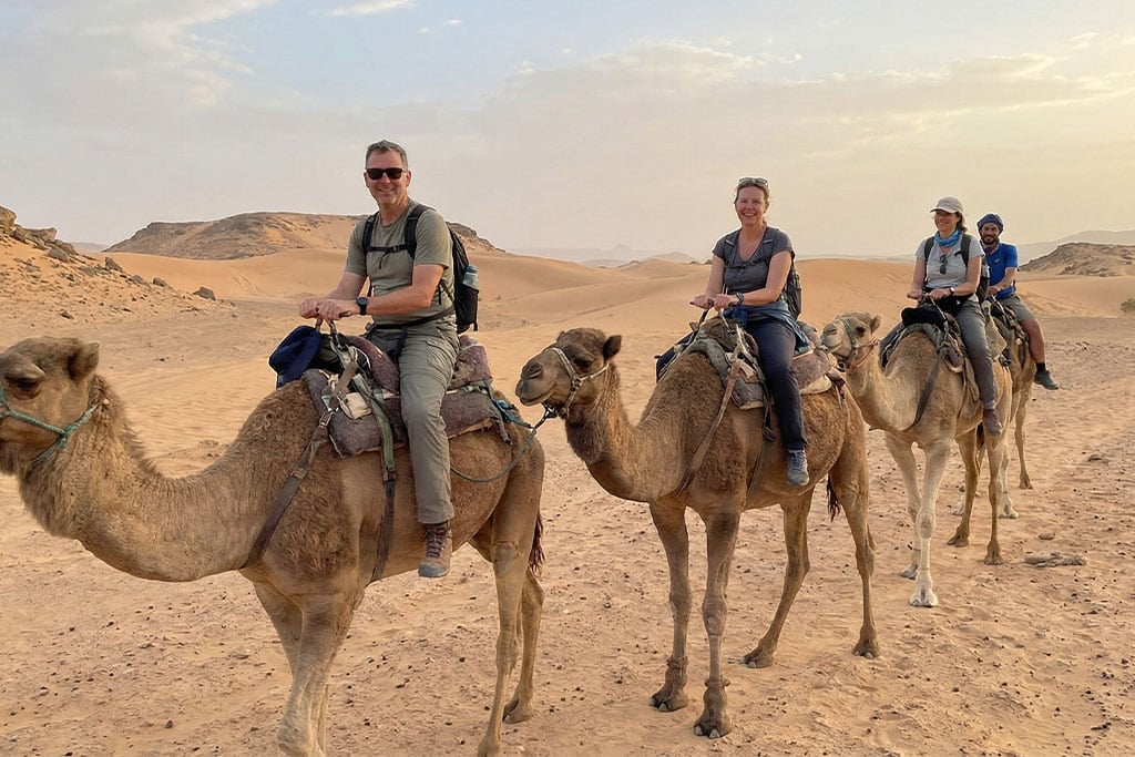 Group enjoying a camel ride hurghada desert safari, camel ride hurghada