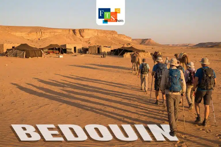 Group walking towards Bedouin tents to buy handmade crafts