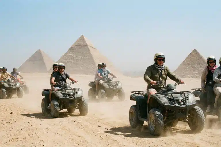 Group of riders enjoying rides near the pyramids quad bike, camel rides