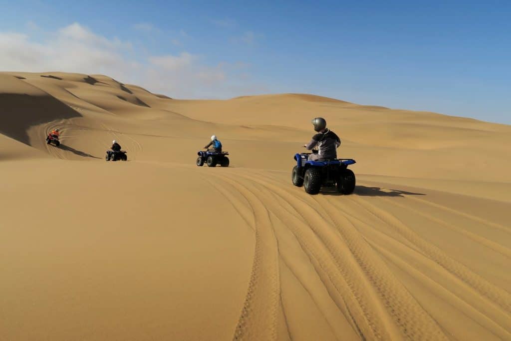 in the desert during a Hurghada adventure, quad biking, camel ride