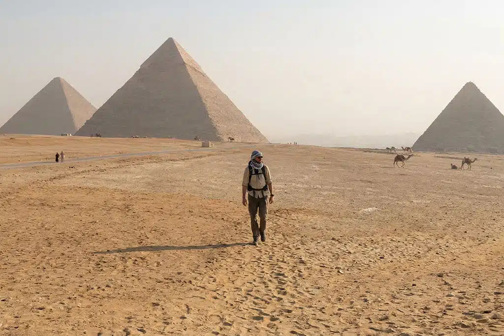 Traveler walking near the Giza Pyramids tour hurghada cairo, giza pyramid tour