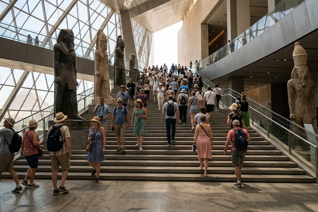 Visitors at the staircase with ancient statues, GEM tickets, giza museum