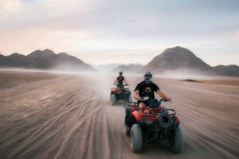 Two riders enjoying in the Hurghada desert quad biking, camel ride