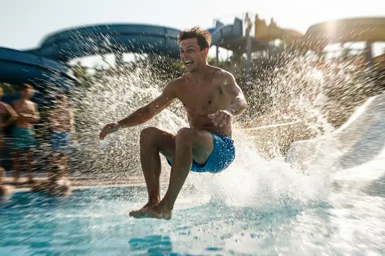 A man splashes into the pool at hurghada jungle aqua park hotel egypt