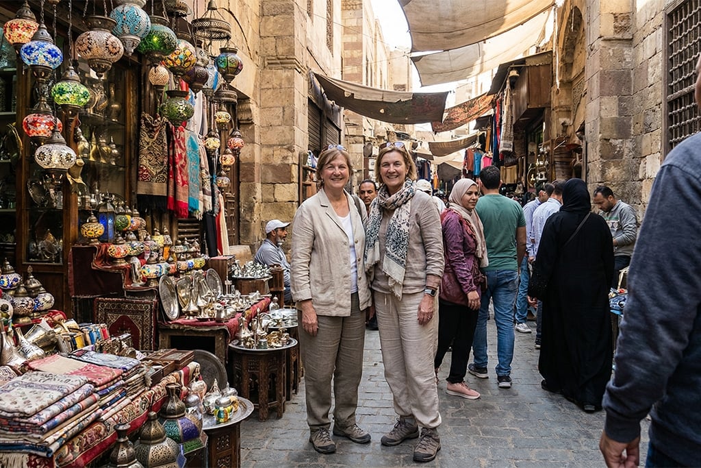 Two women exploring the bustling market. khan khalili, khan al khalili