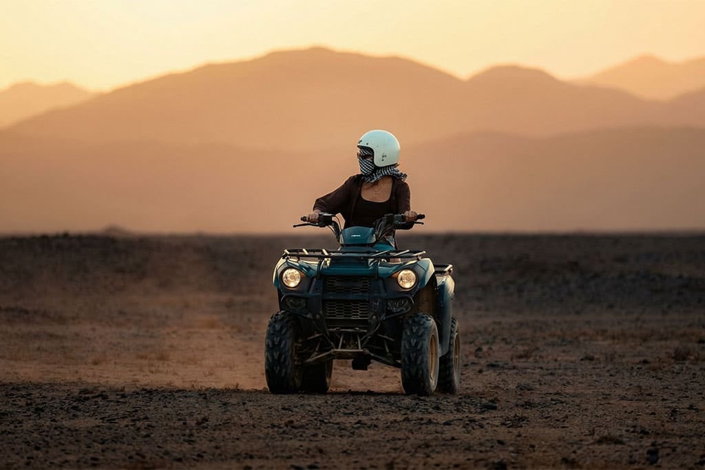 Rider on an ATV in the Marsa Alam desert during sunset, safari marsa alam, camel ride marsa