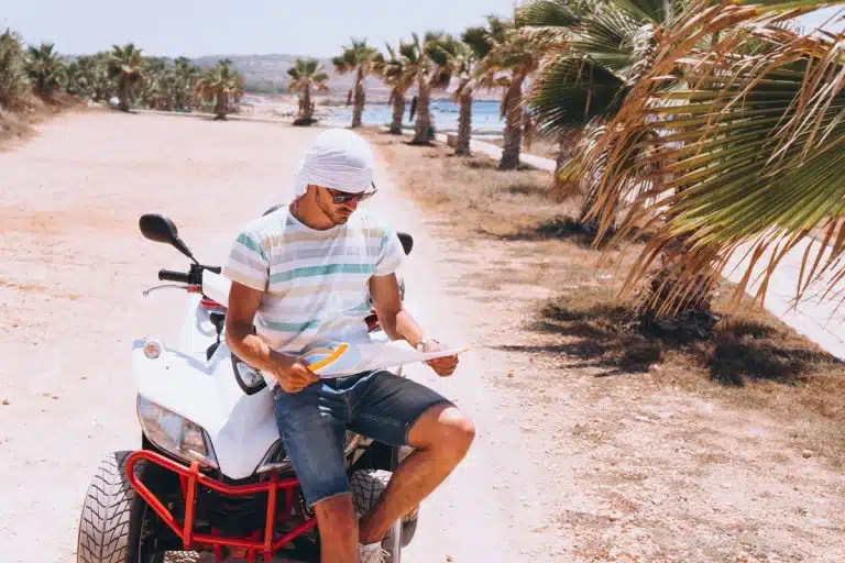 Traveler on a quad bike reviewing a map hurghada quad tour, quad safari hurghada
