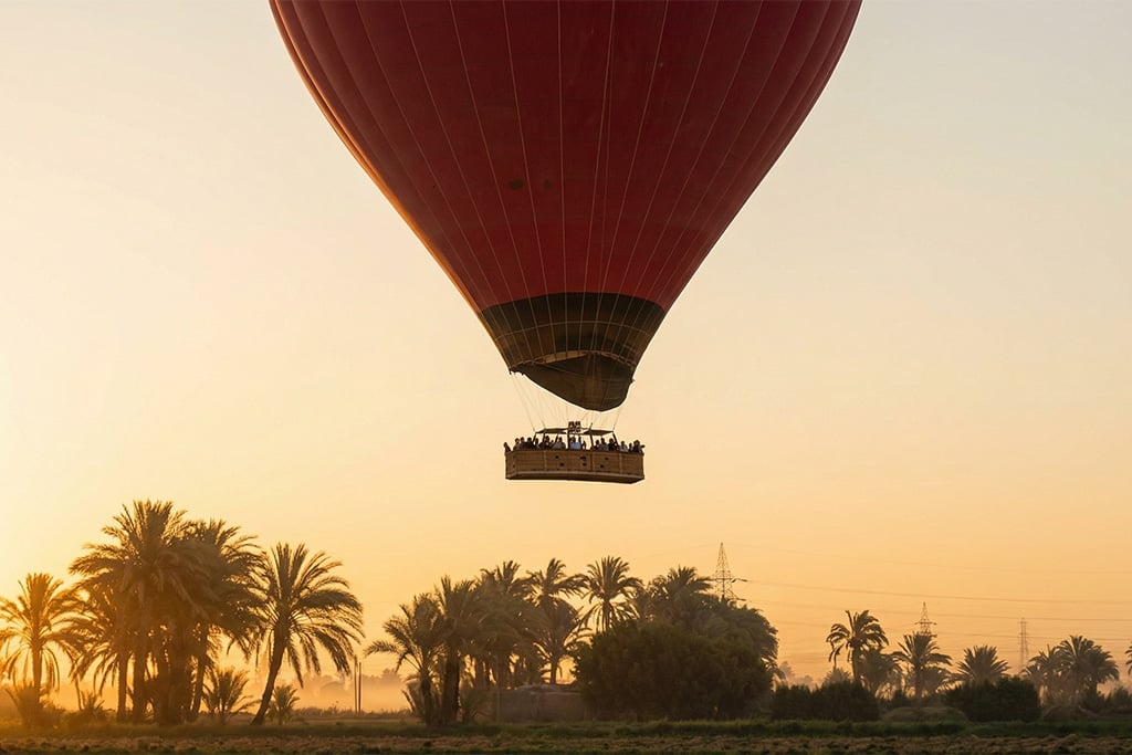 Hot air balloon over Luxor at sunrise overnight train, overnight journeys