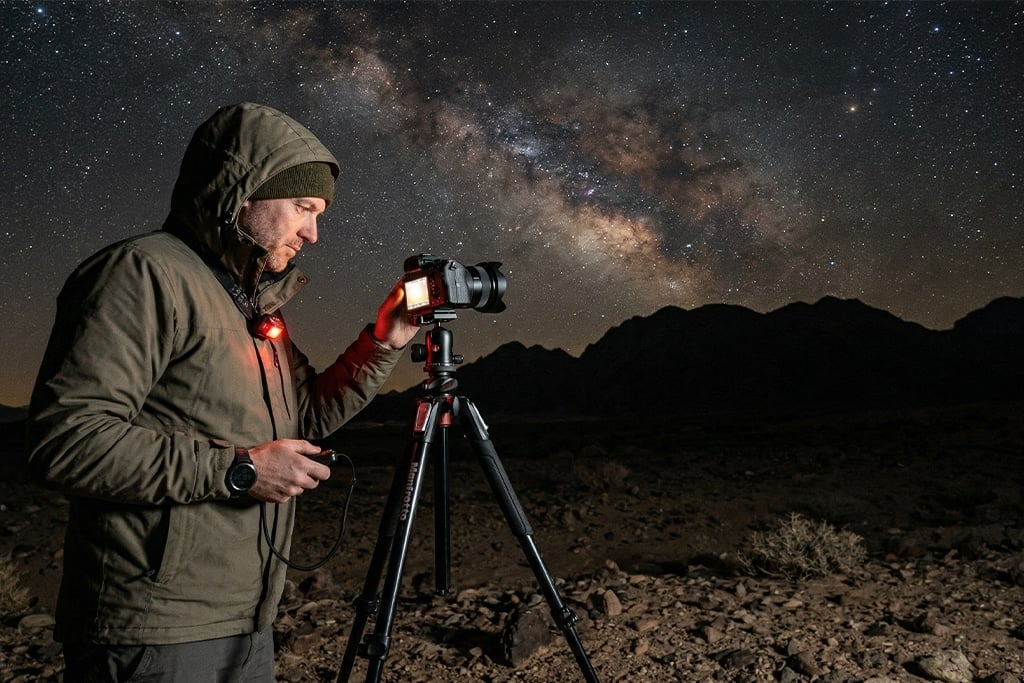Photographer capturing the Milky Way luxury dinner set, stargazing tours