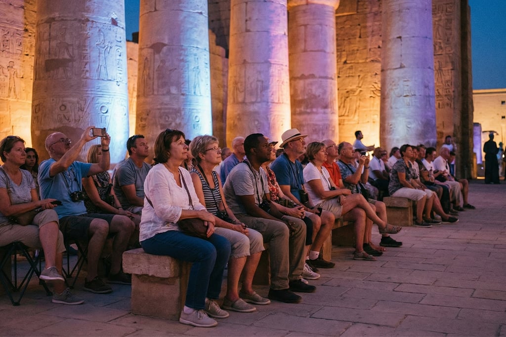 Audience enjoying the sound and light show at Luxor temples, karnak and luxor temples