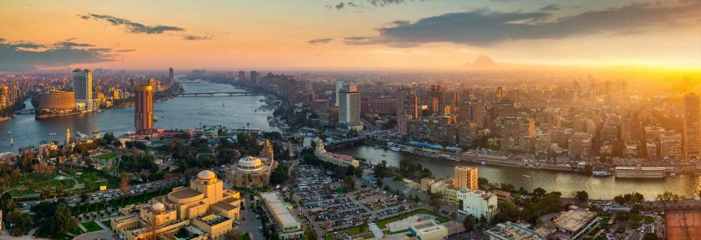 Cairo skyline at sunset with the Nile River, egypt cruise, egypt trip