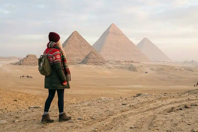 Traveler at Giza pyramids christmas light tour, christmas market tour