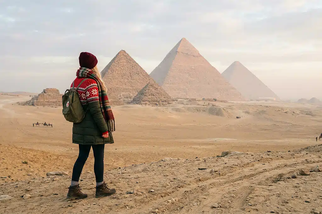 Traveler at Giza pyramids christmas light tour, christmas market tour
