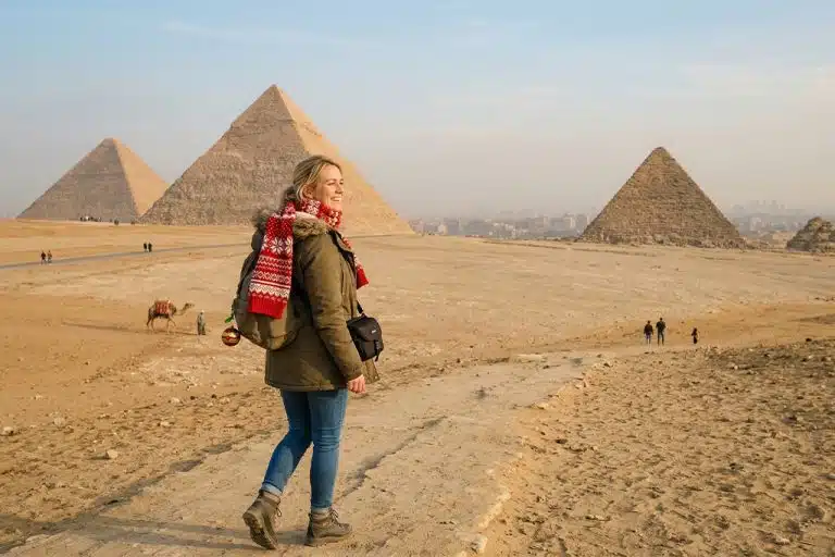 Traveler walking near the Pyramids of Giza christmas tour 2024, christmas tours 2025