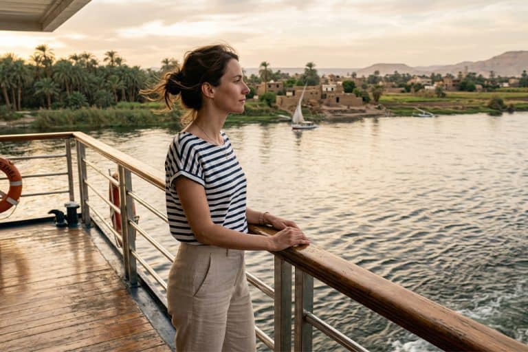 Woman enjoying the view luxor nile cruise, nile river dinner cruise